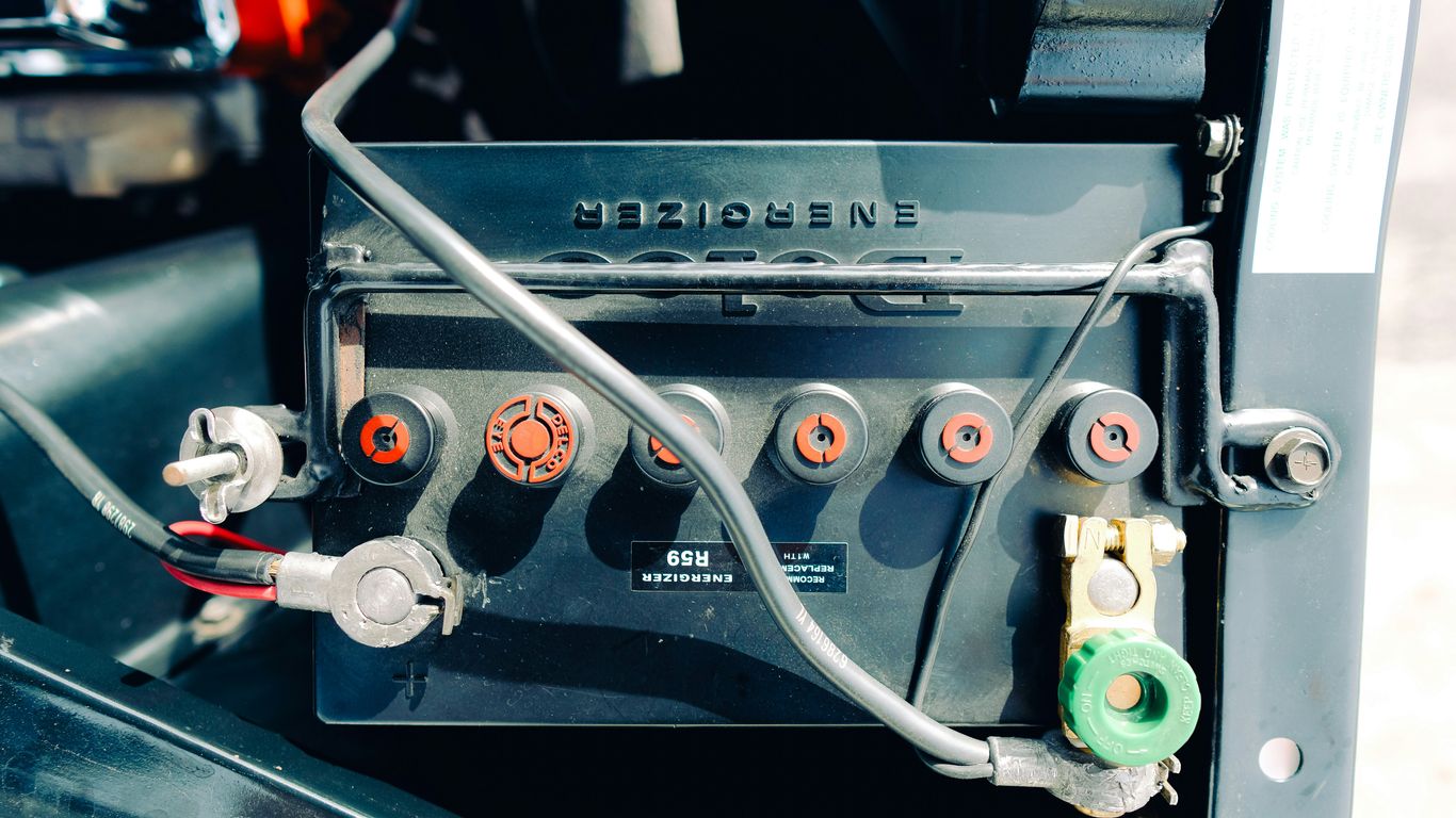 Close-up of a car battery with wires connected