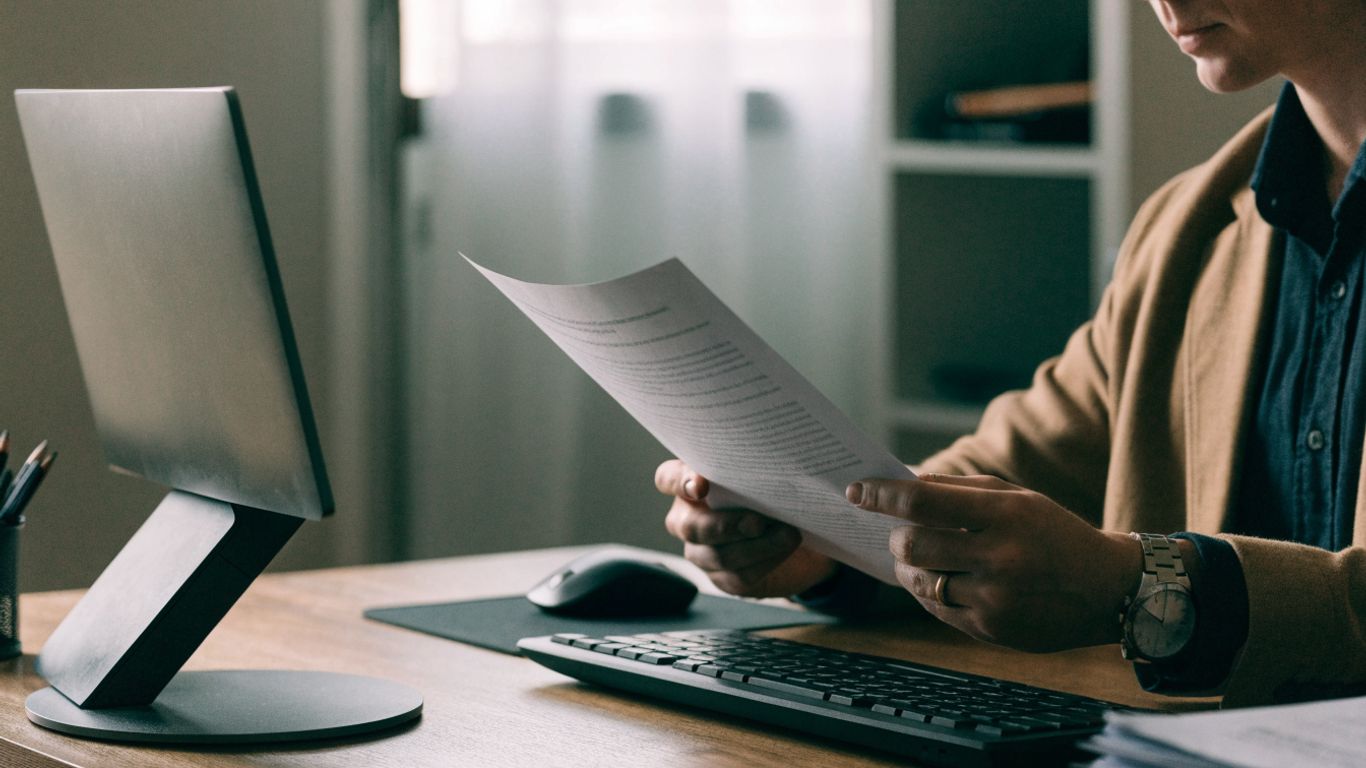 Trader reviewing challenge rules at a desk