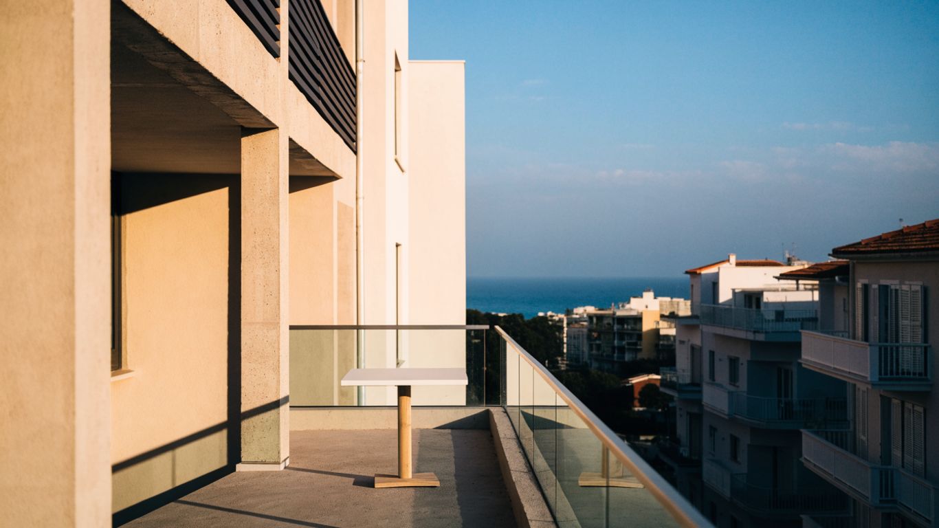 Modern Limassol apartment balcony overlooking coastal buildings