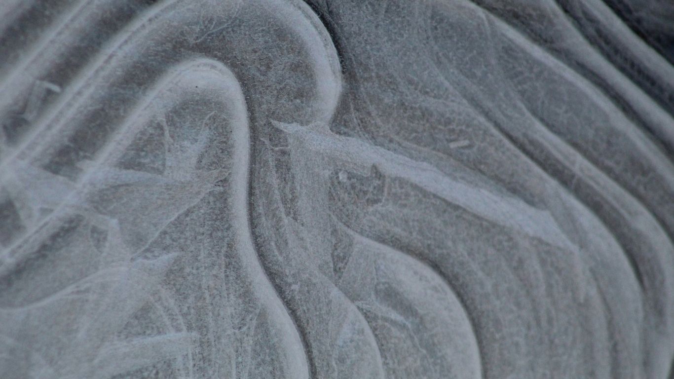 a close up view of a frosty surface