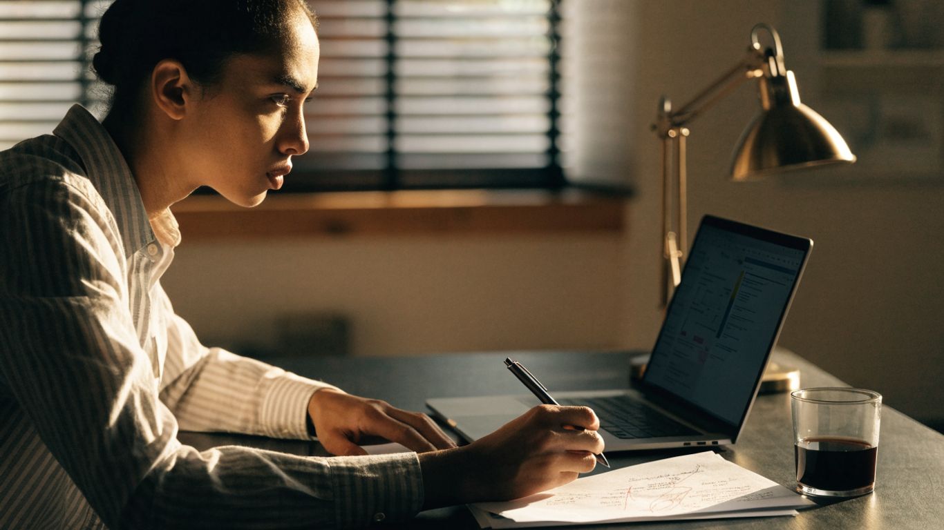 Trader planning a futures evaluation at a desk