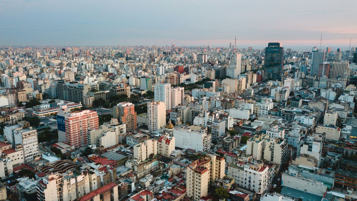 aerial view of city under cloudy sky during daytime
