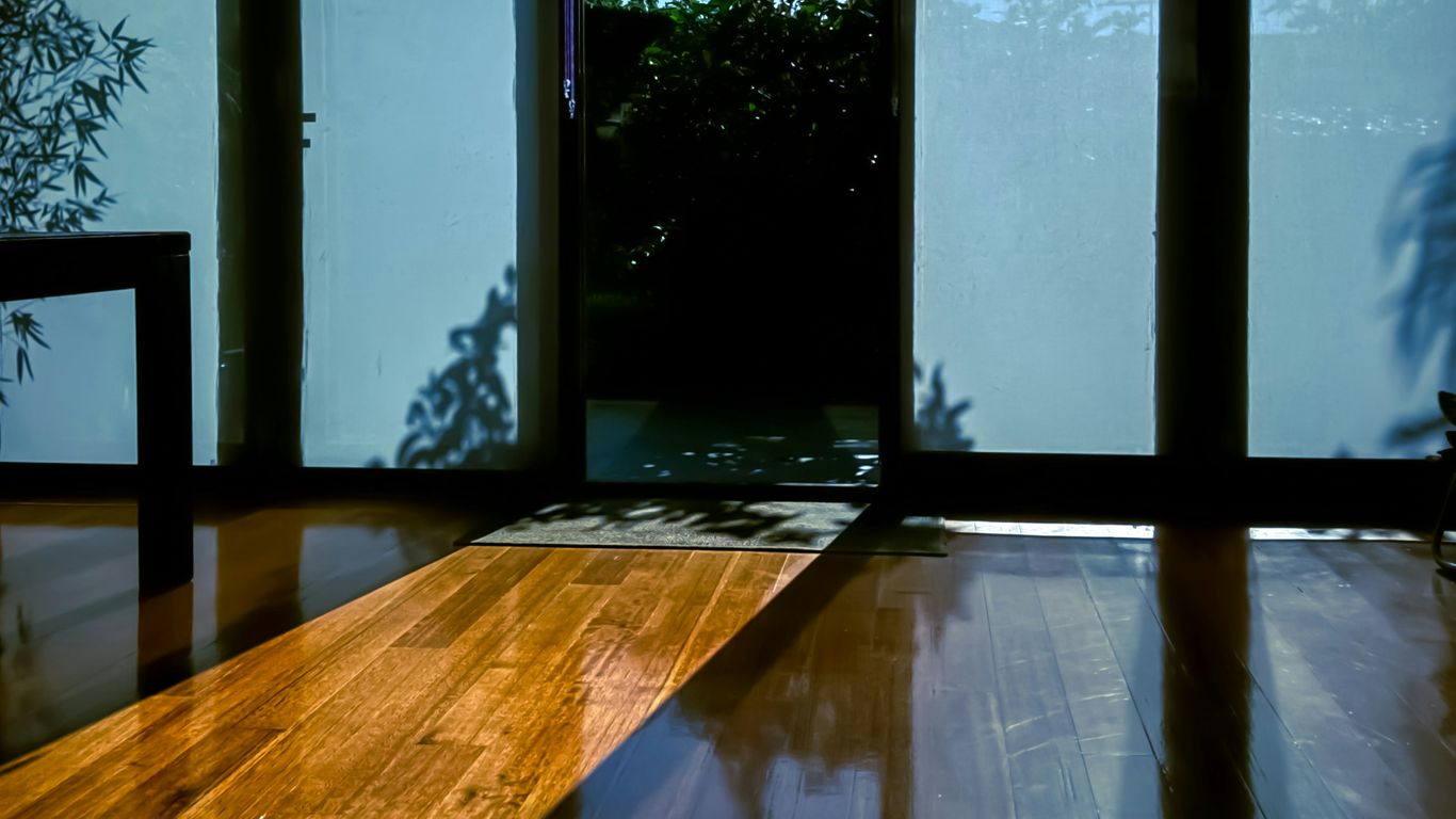 Yoga mat thicknesses beside wooden floor