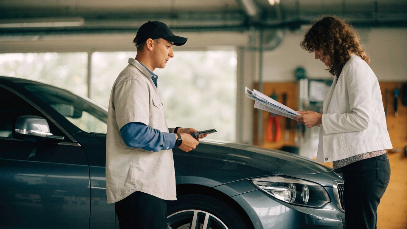 Parts specialist inspecting a vehicle identification number