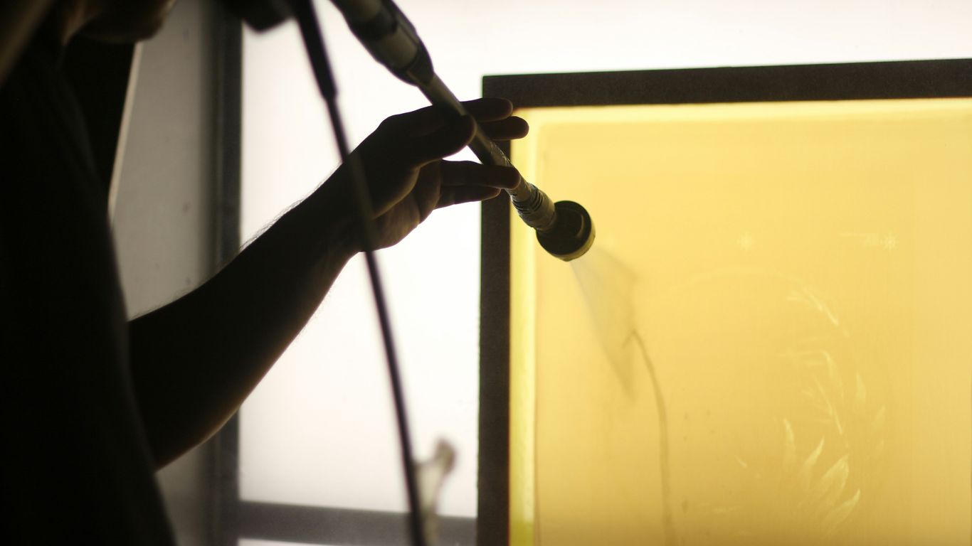 a person holding a drill