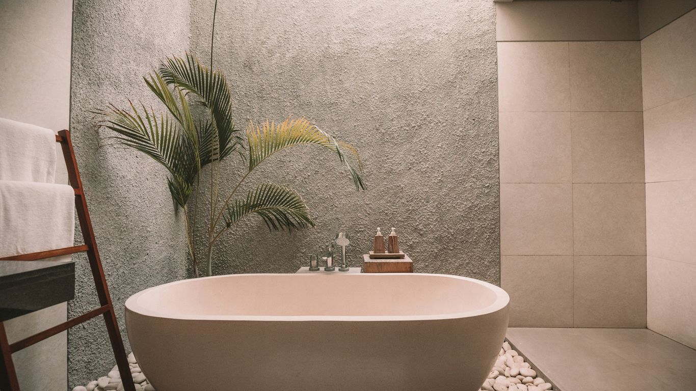 Calm bathroom with sculptural stone basin