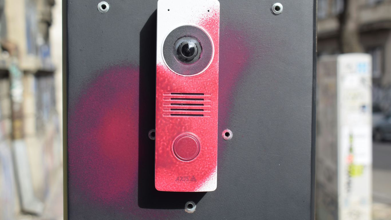 Intercom device with red spray paint markings