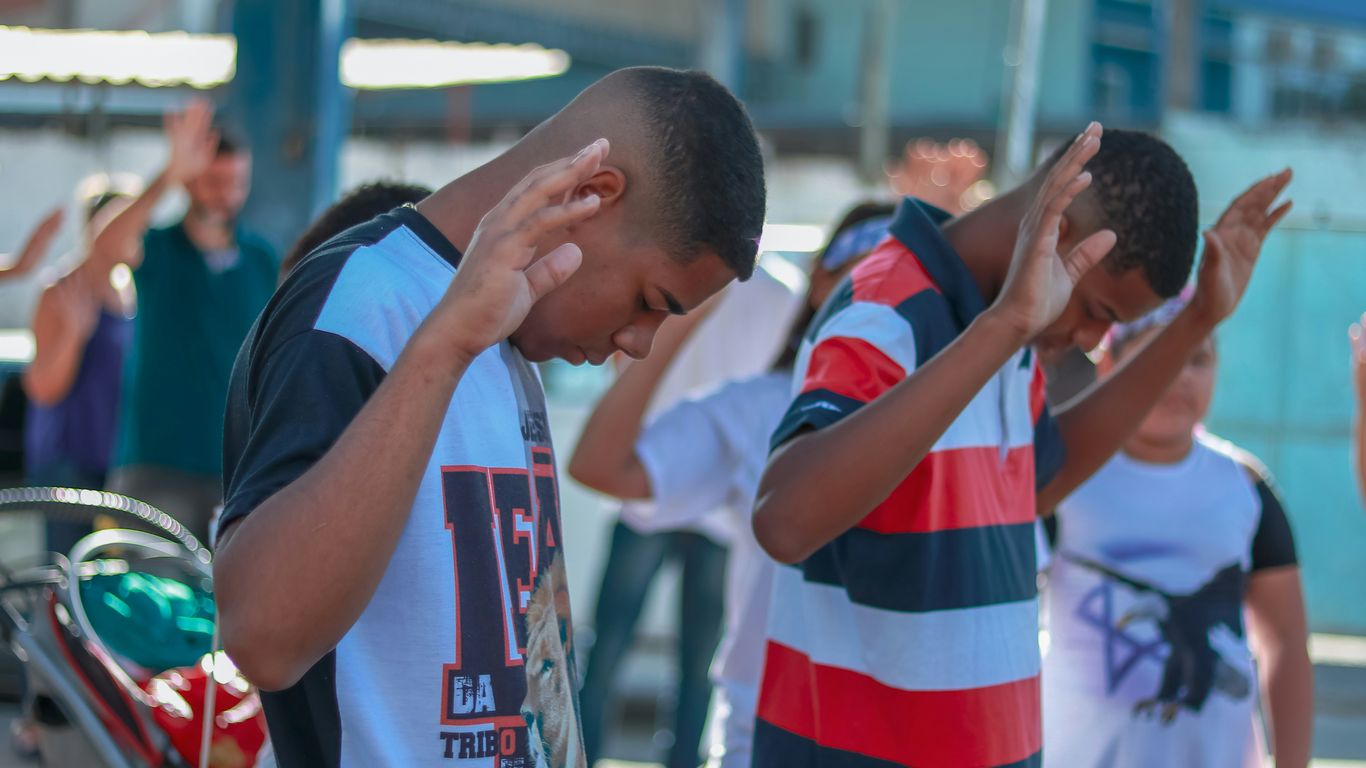 selective focus photography of people praying