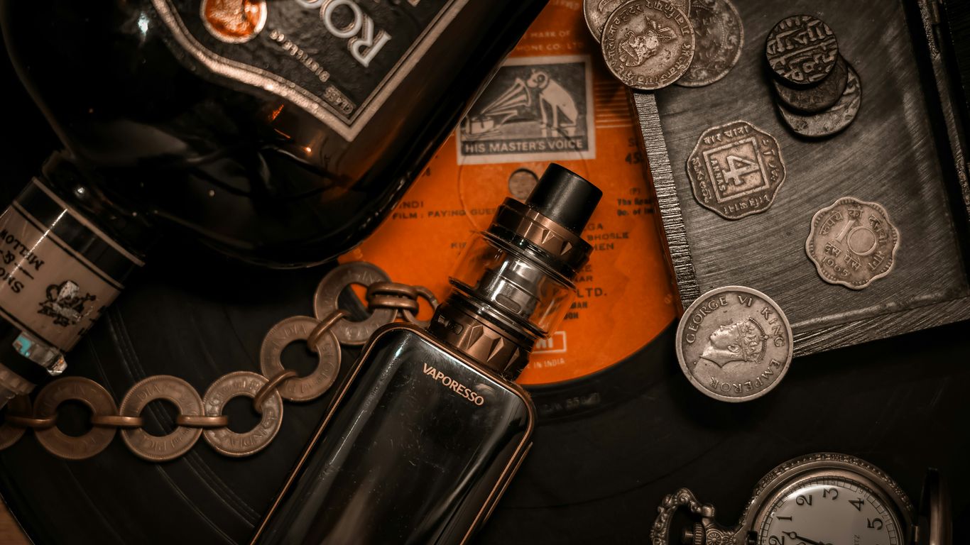 Vape devices arranged beside shipping paperwork