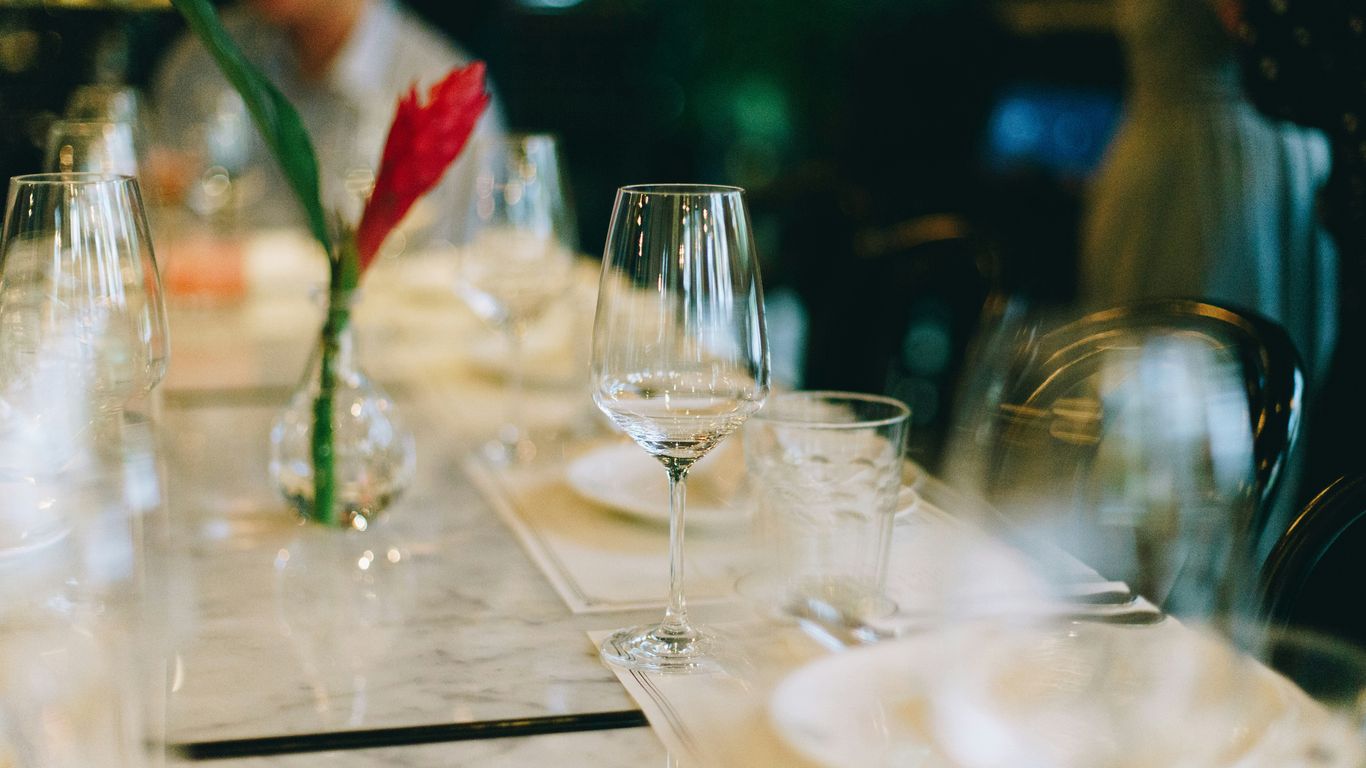 selective-focus photography of wine glass on table