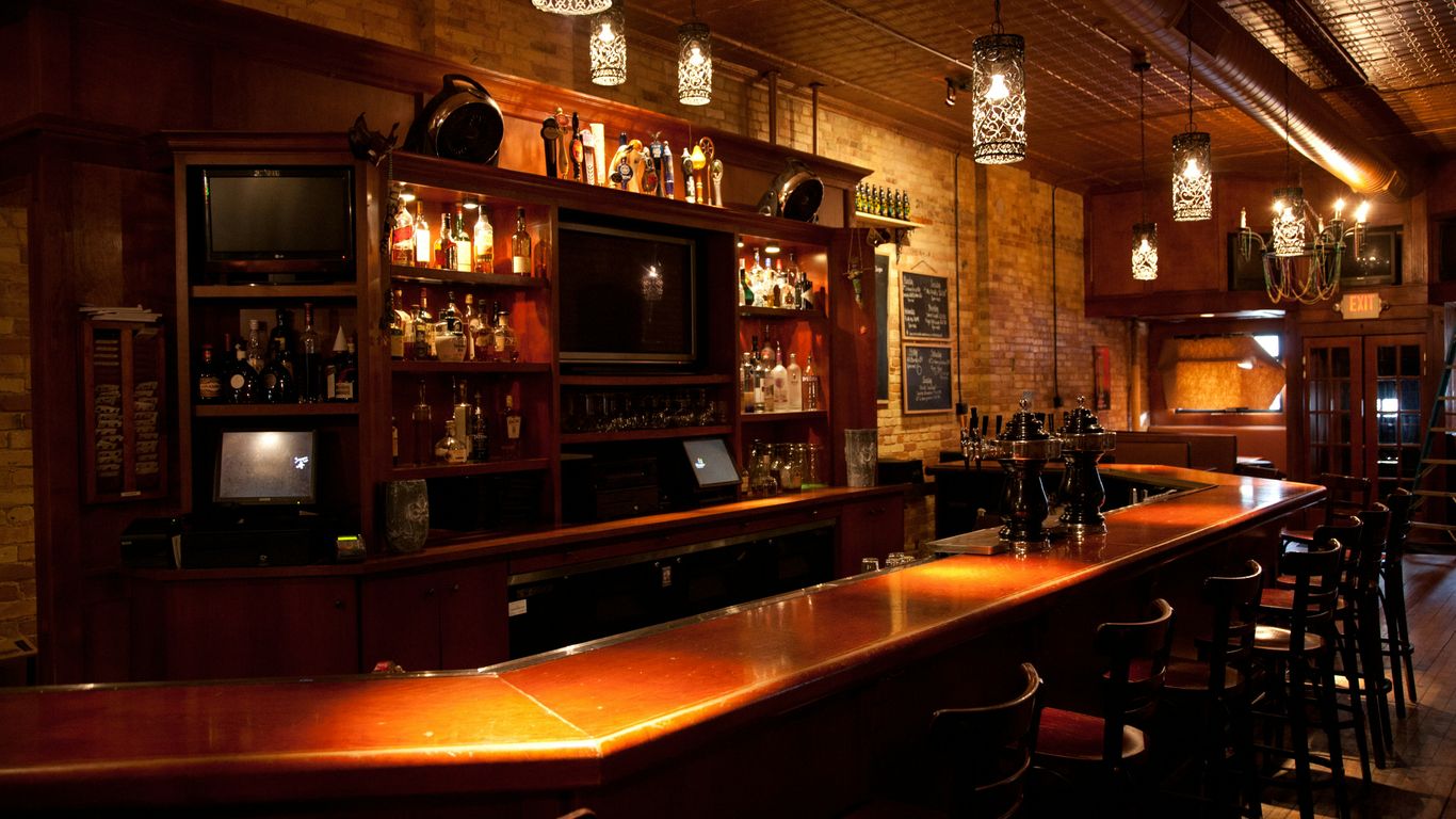 Ornate bar and dining area with high ceilings