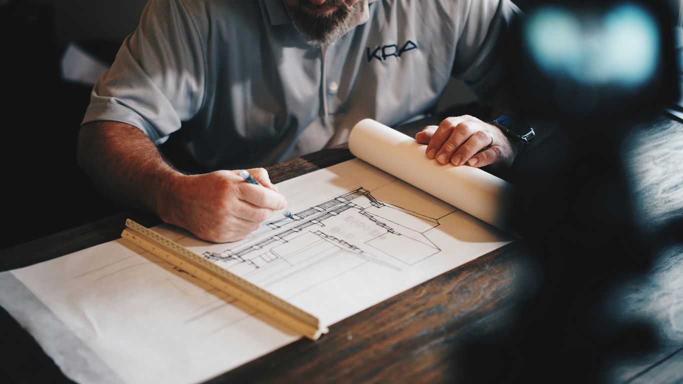 An architect reviewing a project plan in an office
