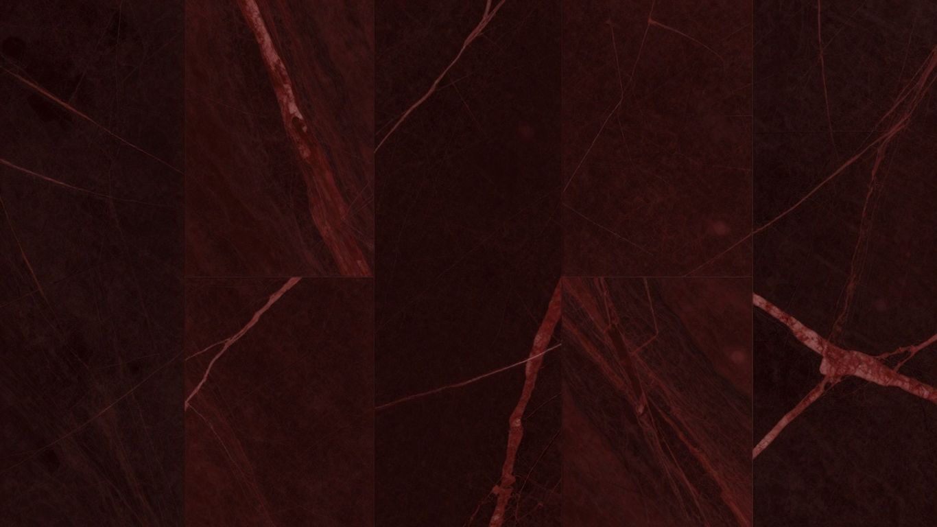Rosso Levanto marble tiles with red veins.
