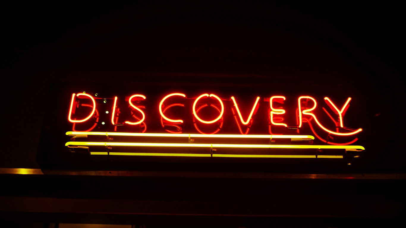 lighted red Discovery neon signage
