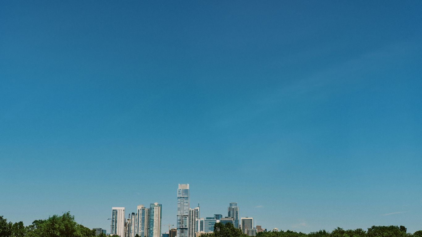 city skyline under blue sky during daytime
