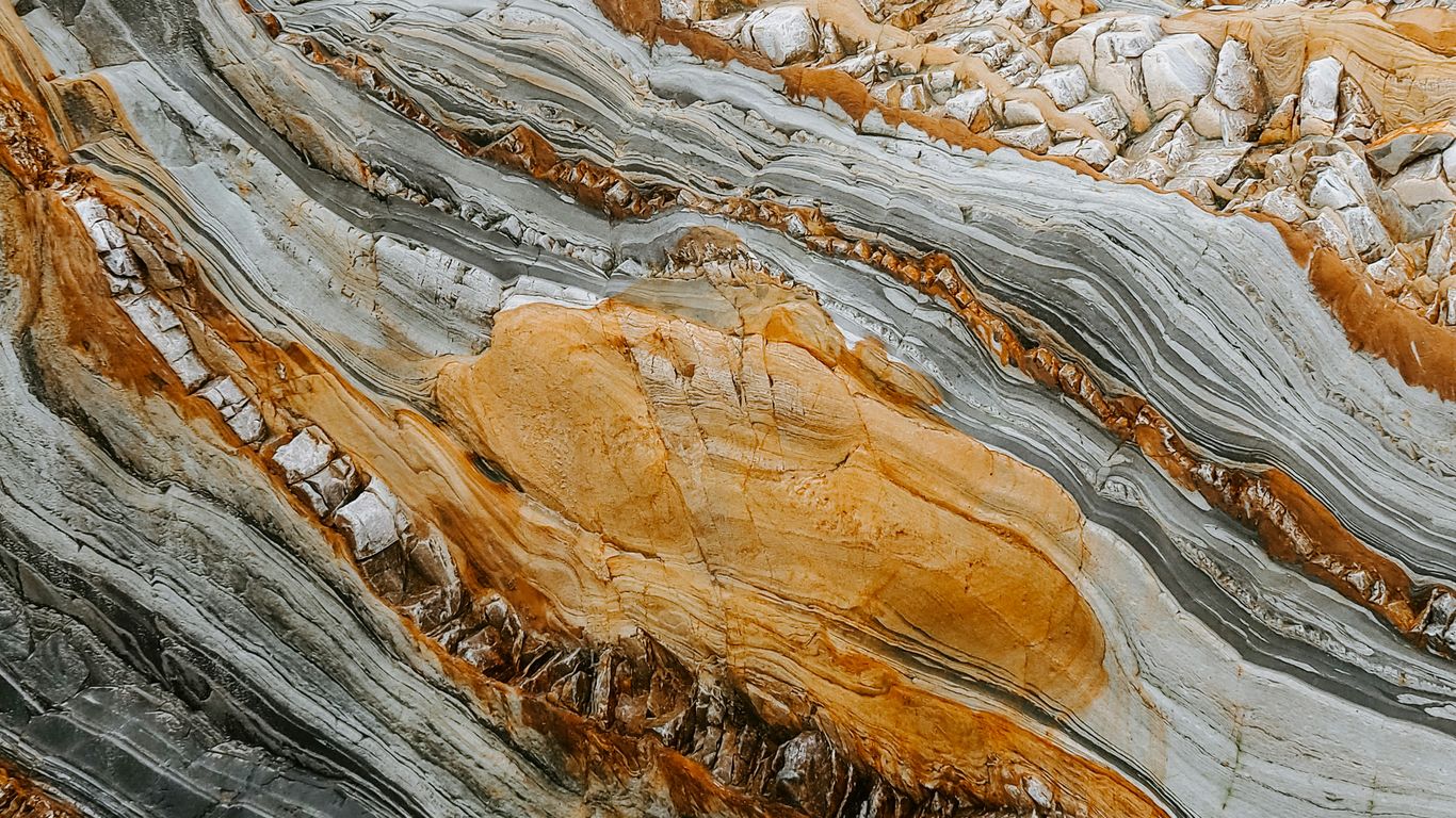 A natural stone slab with varied veining
