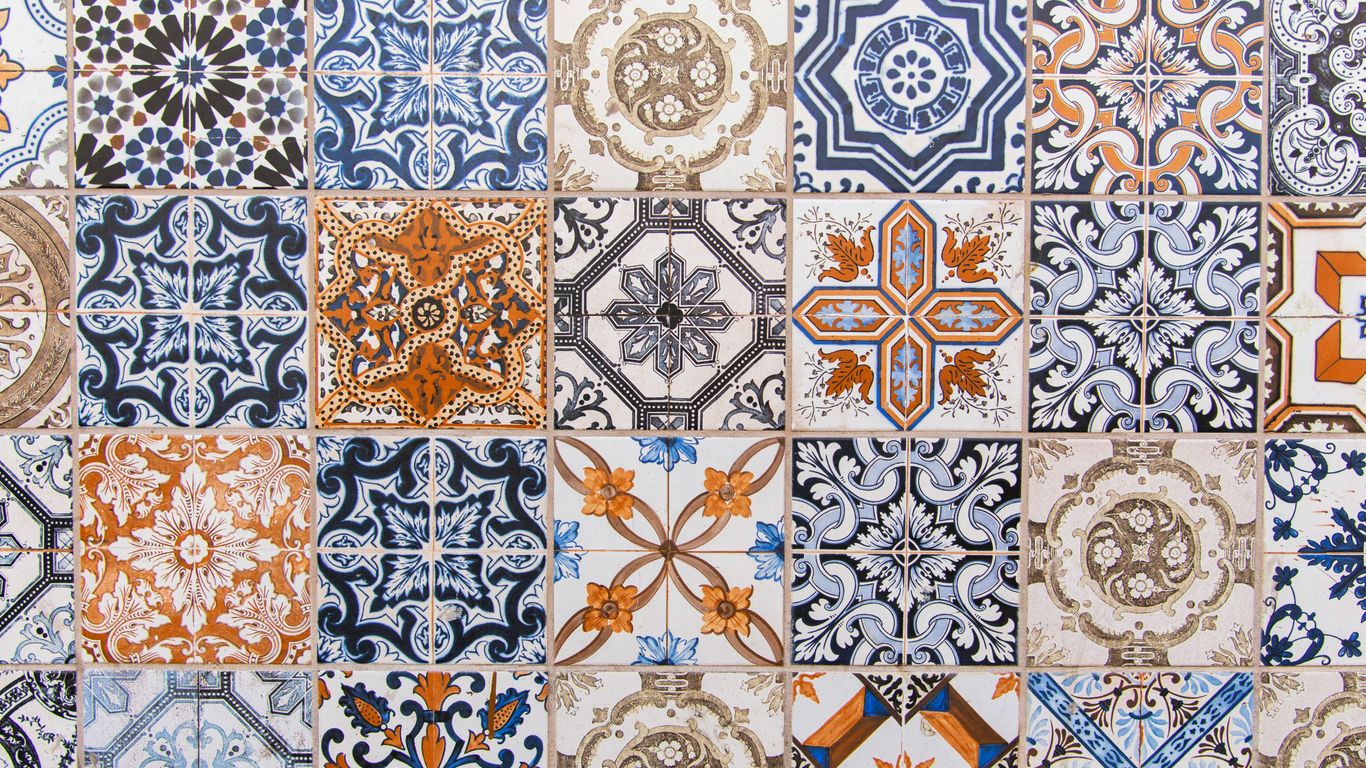 Colourful Peranakan tiles beside shophouse doorway
