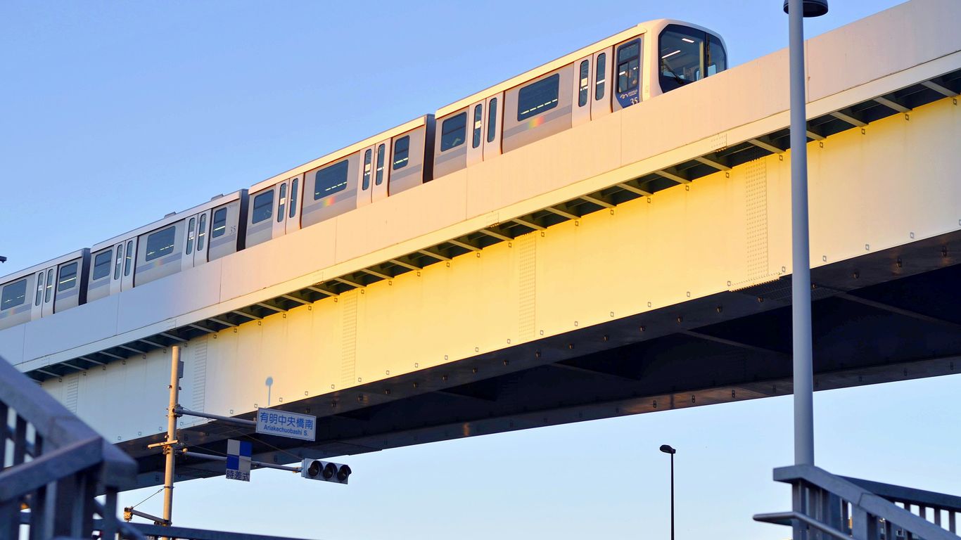 white subway on concrete bridge during daytime