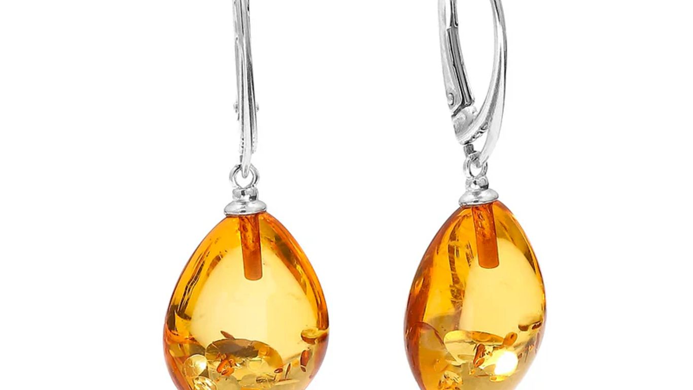 A pair of amber drop earrings with silver leverback clasps.