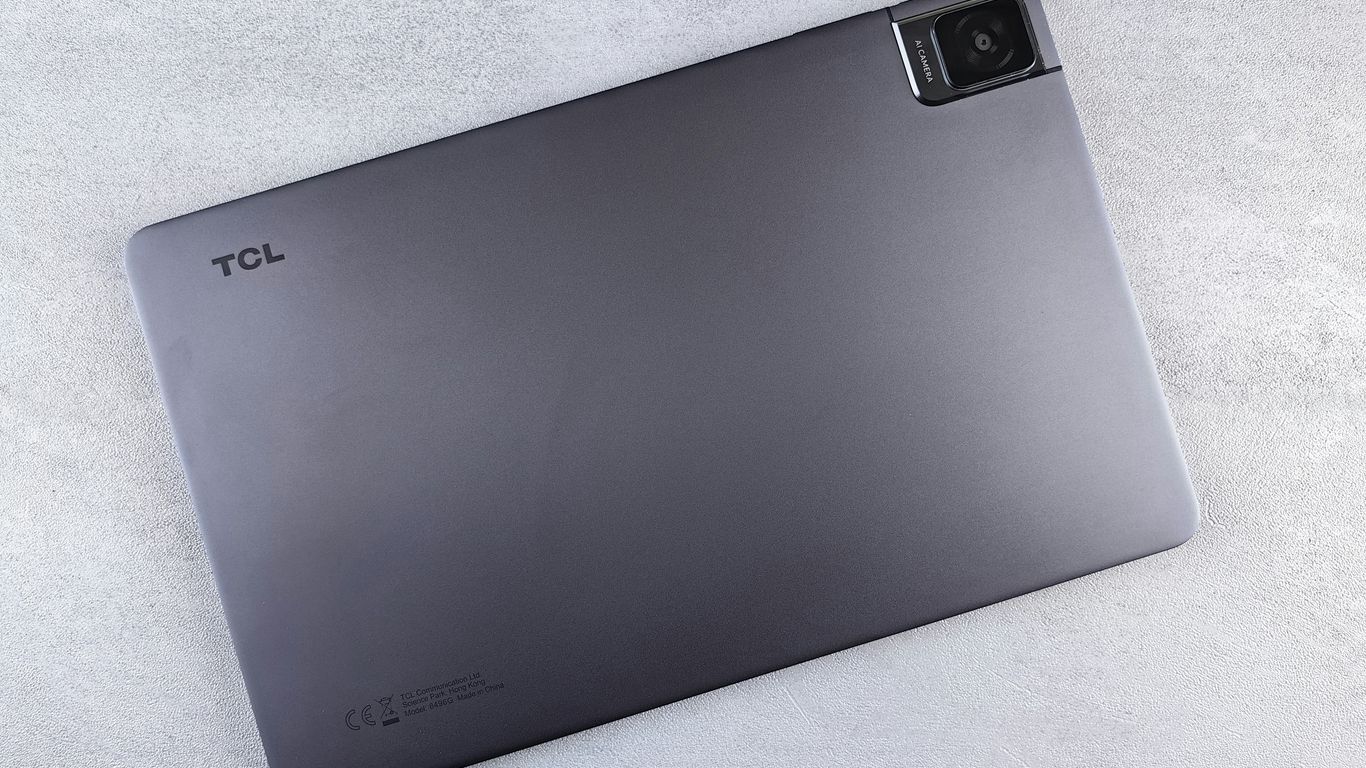 a laptop computer sitting on top of a white table