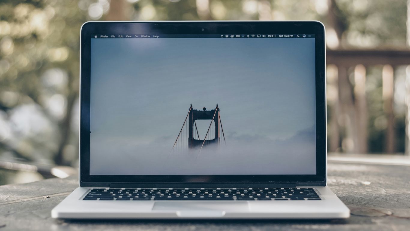 A laptop showing yoga video
