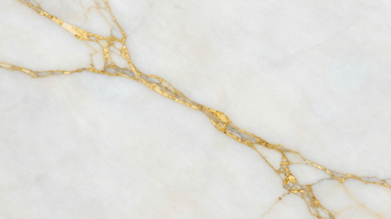 Polished Calacatta Gold marble slab with golden veins.