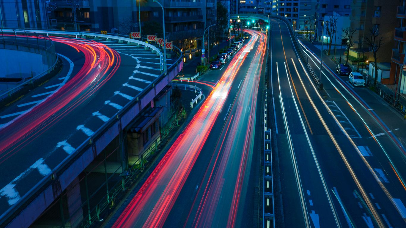 time lapse photography of cars on road during night time