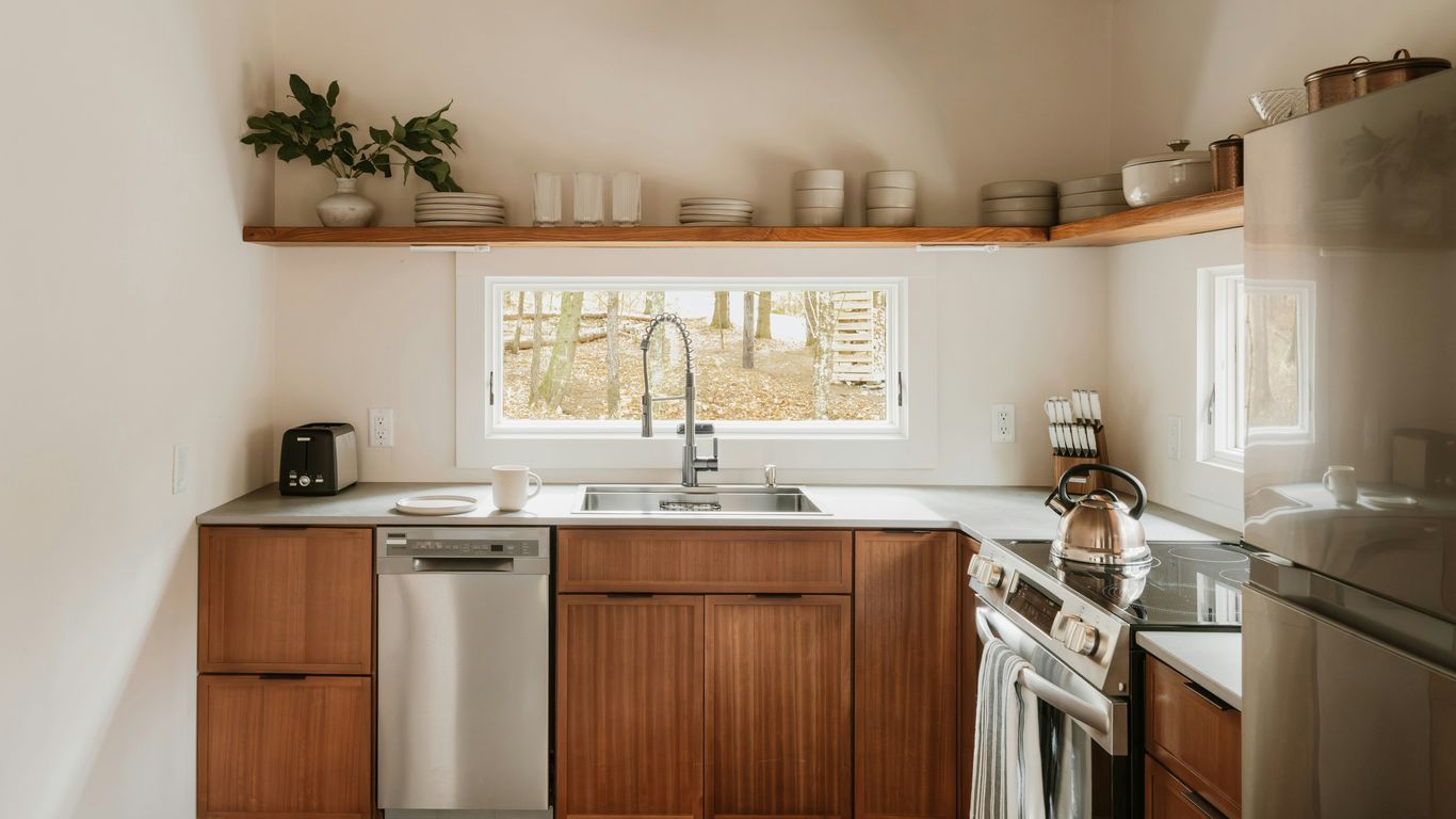 Modern kitchen with wooden cabinets and stainless steel appliances