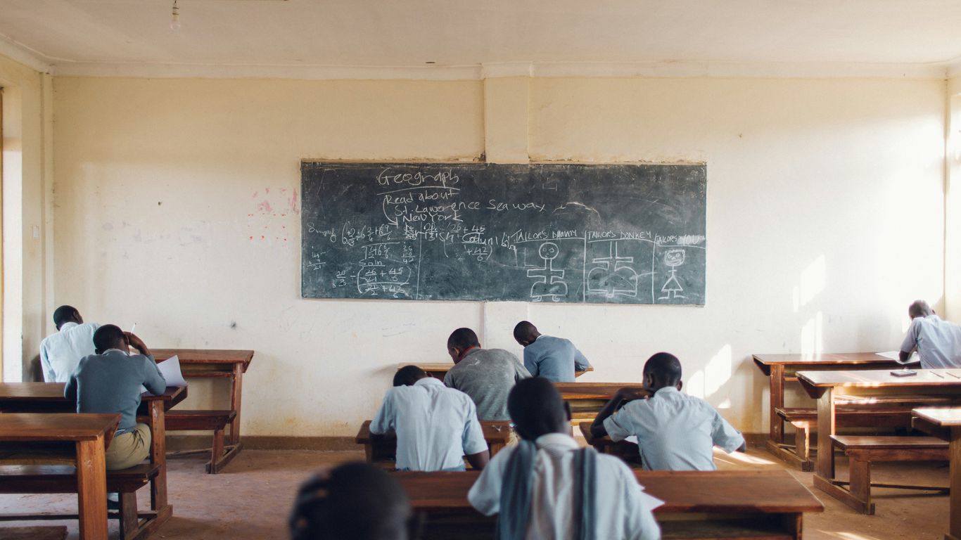 Children and caregivers playing in classroom