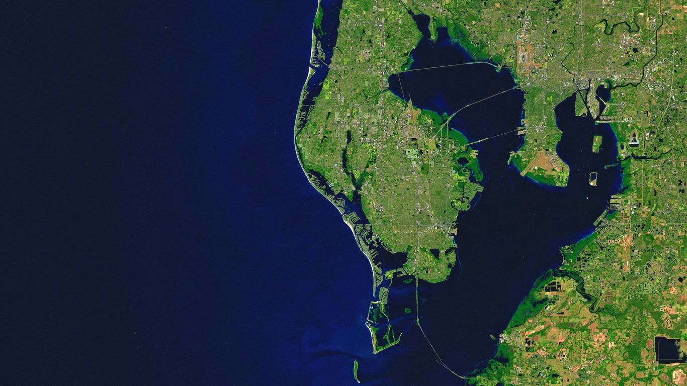 Aerial view of a coastline with a large bay.