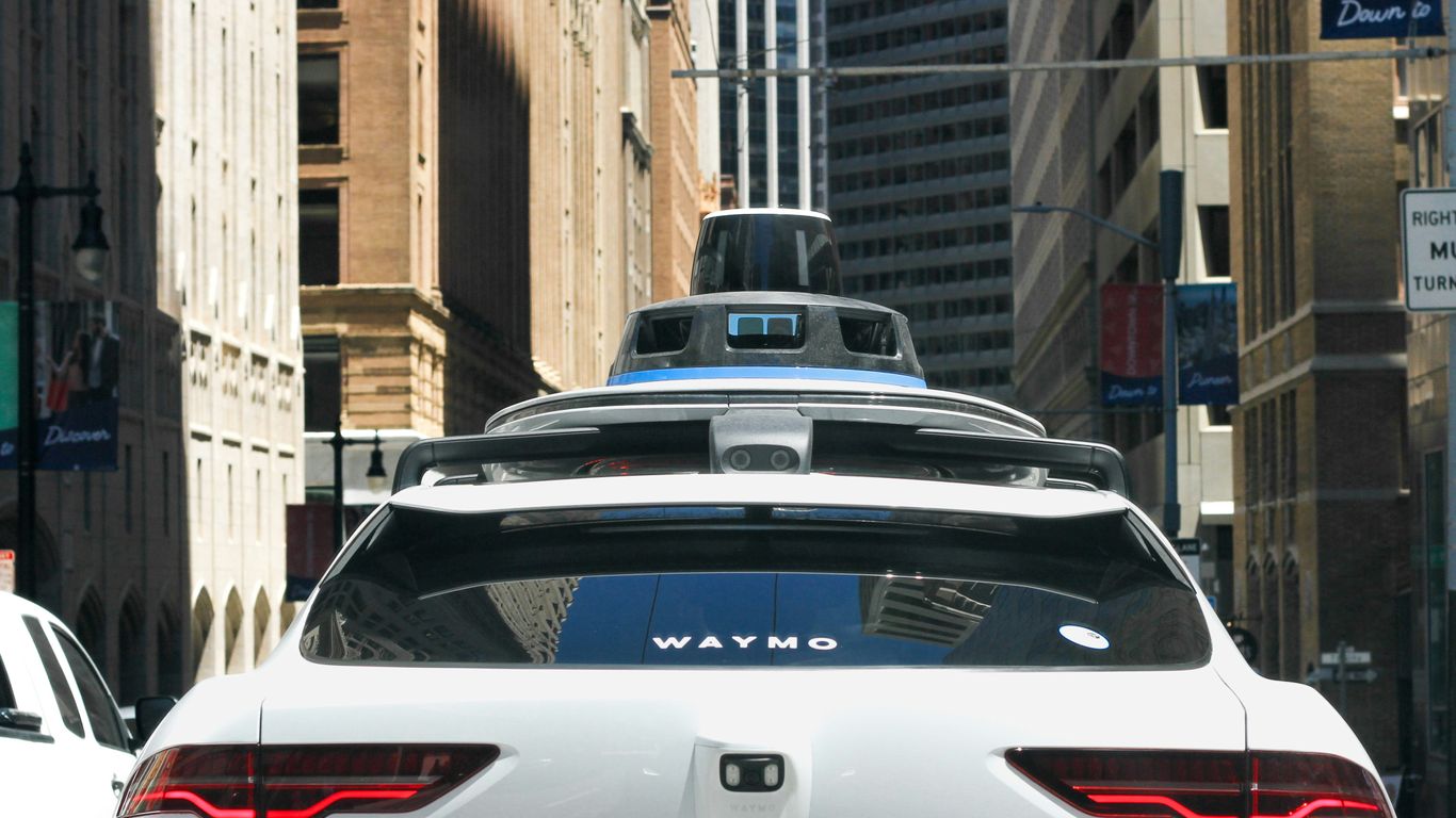 a car that is driving down the street