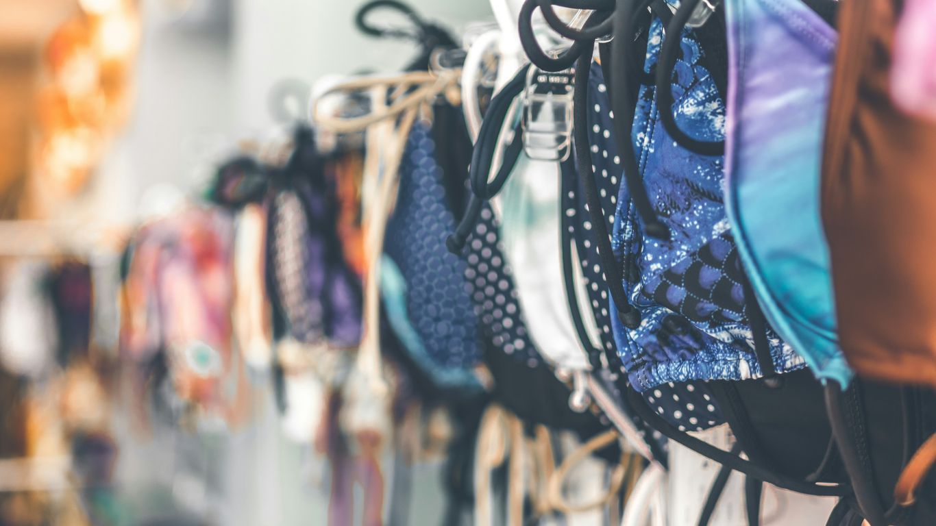 a row of bras hanging on a wall