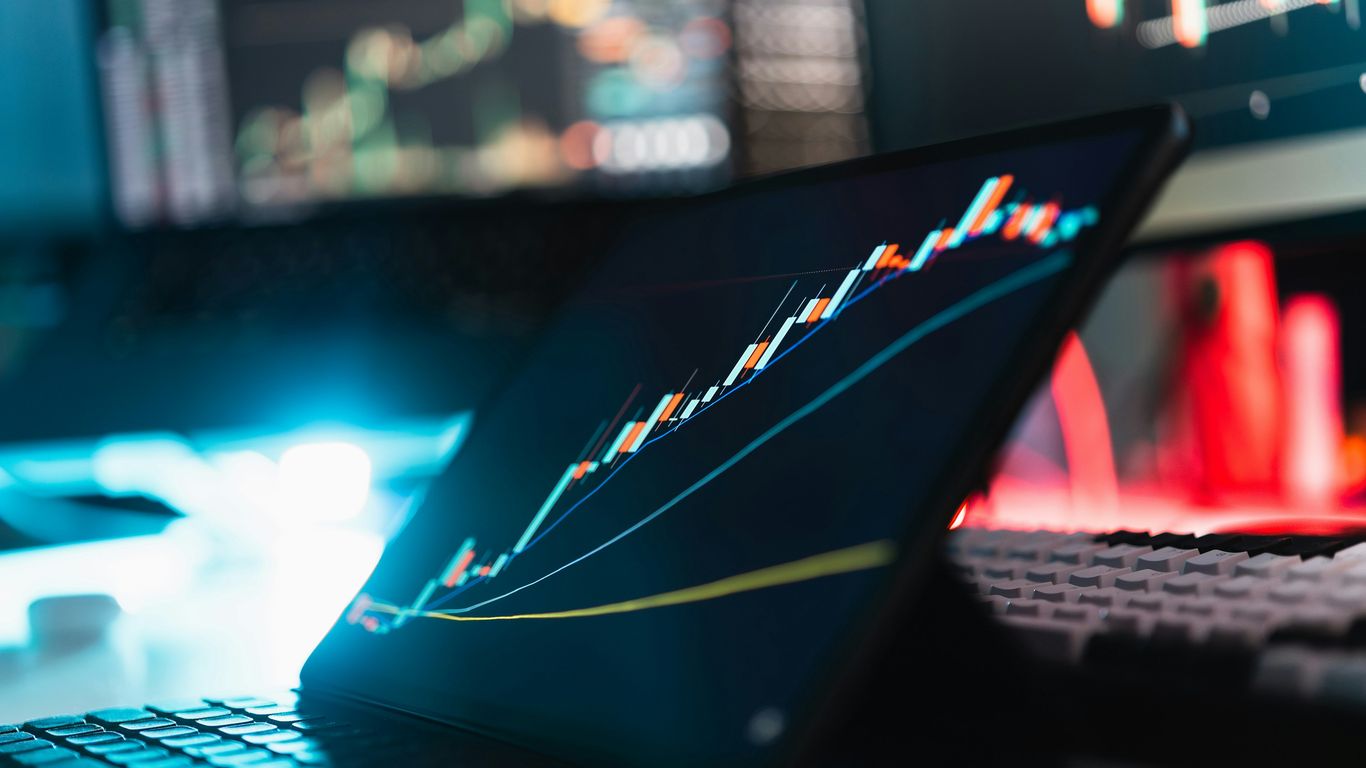 A laptop computer sitting on top of a desk