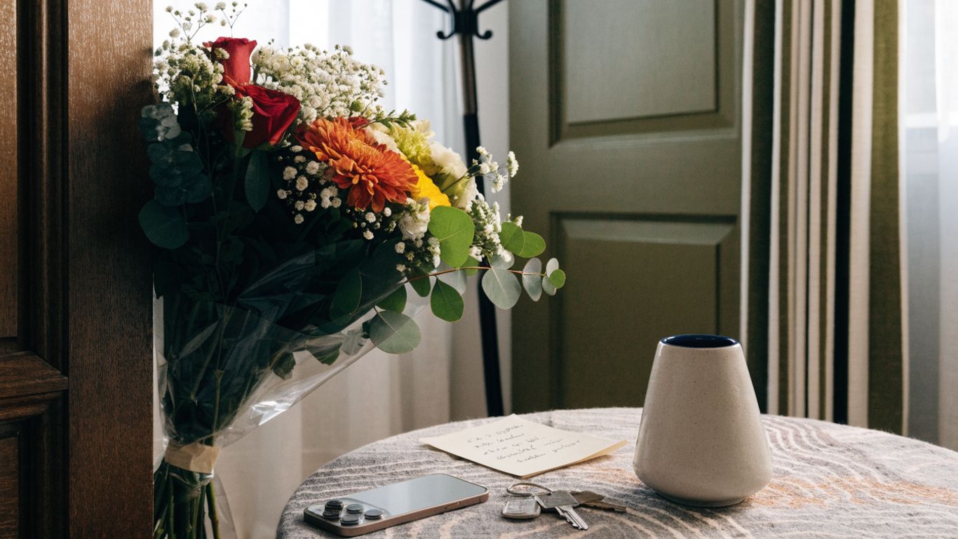 Clear delivery notes beside a flower bouquet