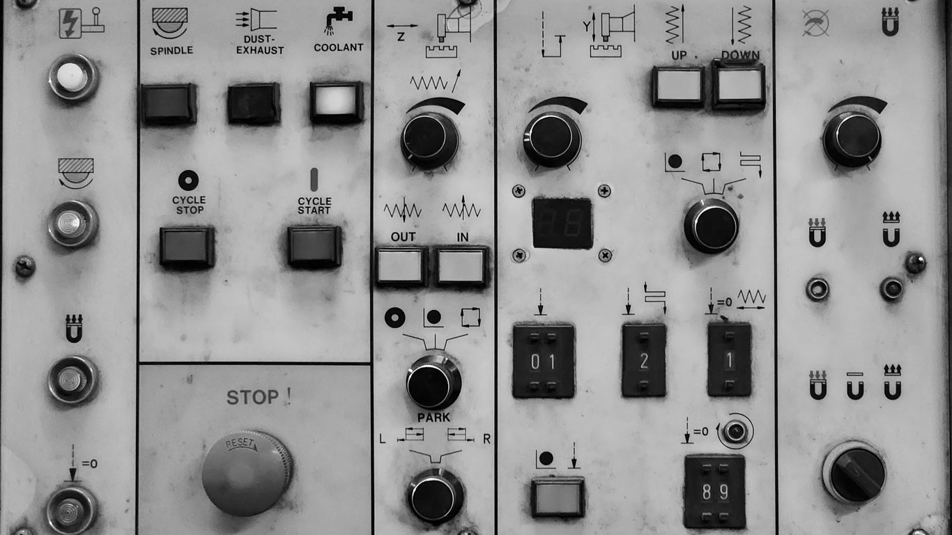a close up of a control panel with buttons and switches