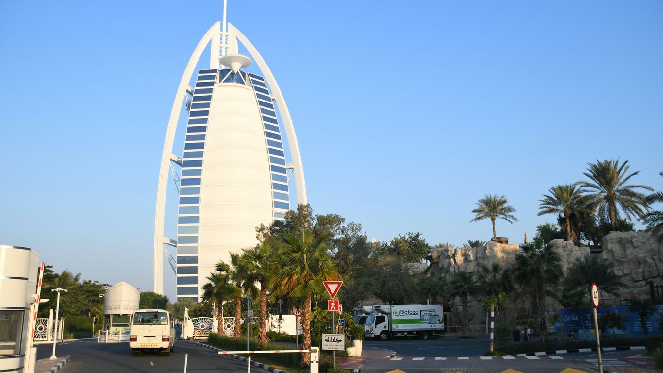a very tall building towering over a city street
