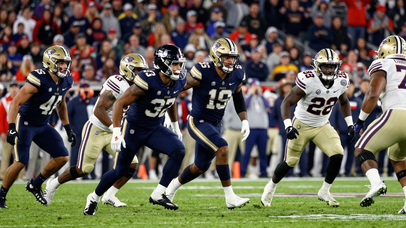 College football players on a field during a game.