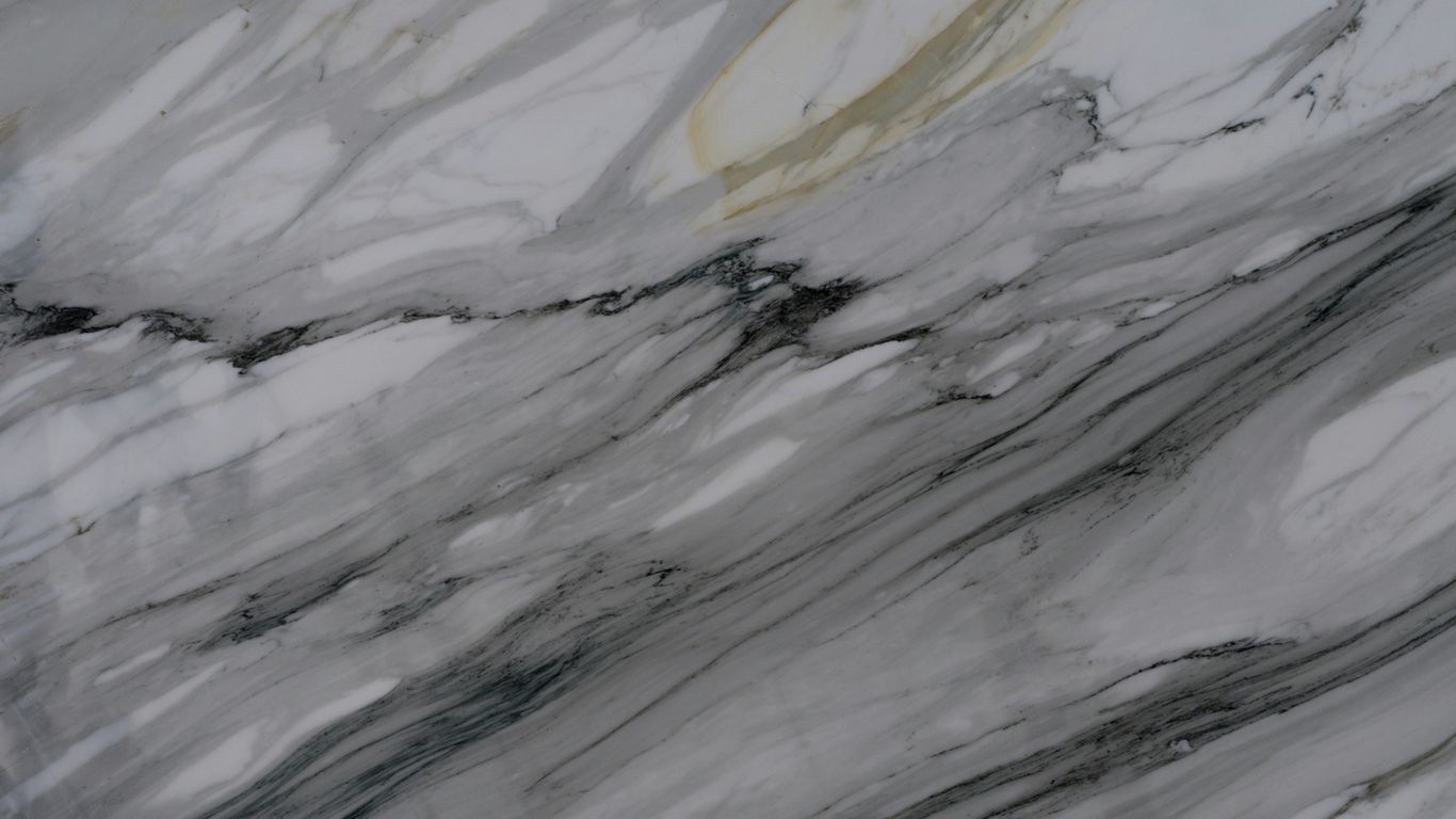 Veined marble slab beside living room sofa