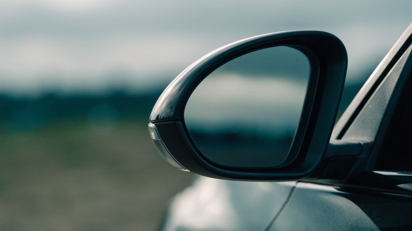 Close view of a car side mirror with integrated signal