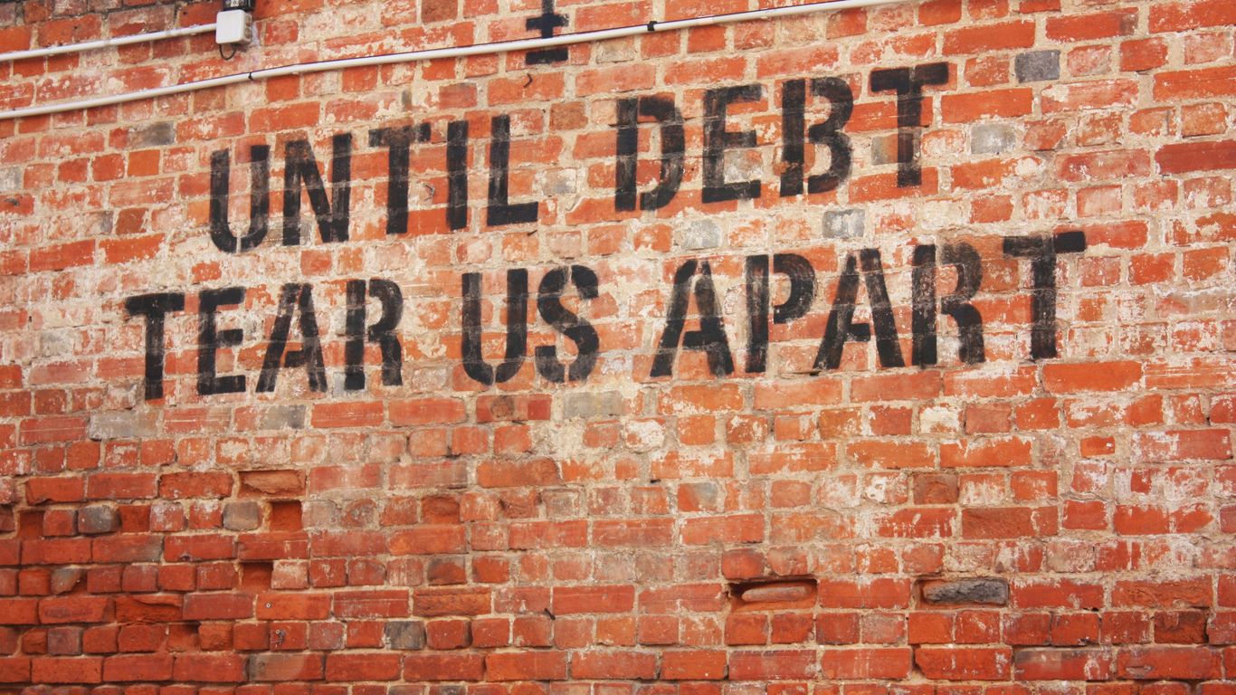 a brick wall with a message written on it