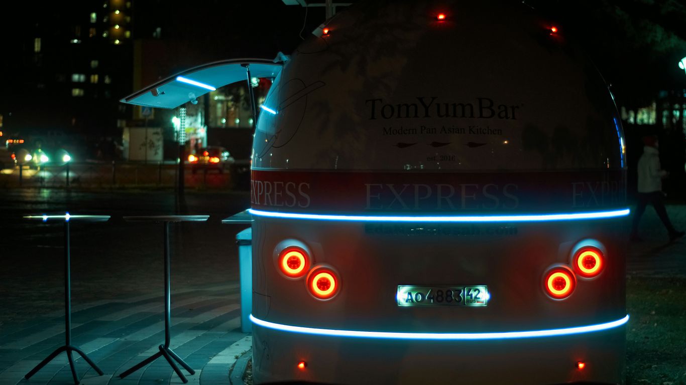 a bus that is sitting on the side of the road