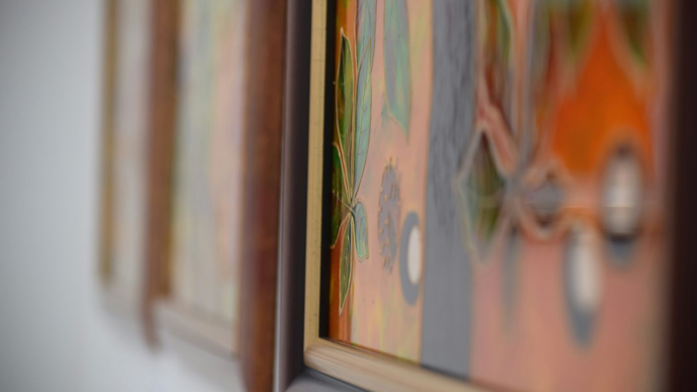 a close up of a painting on a wall