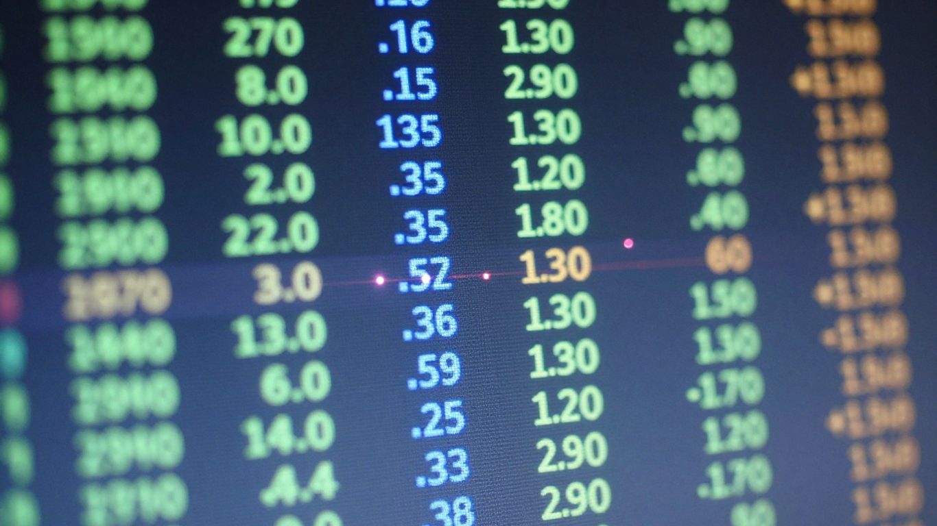 Digital interface with dynamic data streams and light flares.