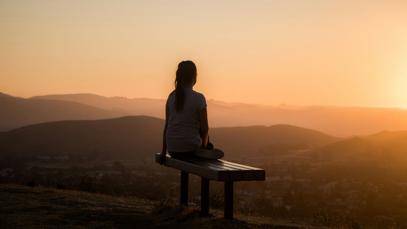 A peaceful person practicing deep breathing exercises