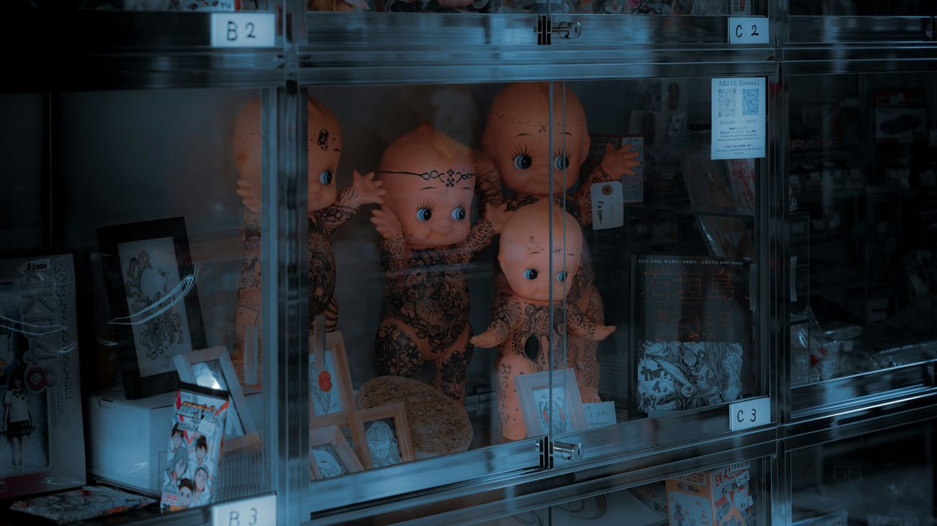 a display case filled with lots of stuffed animals