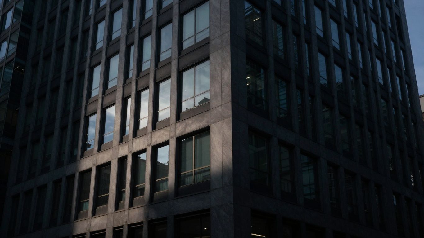 Modern office building with a dark shadow.