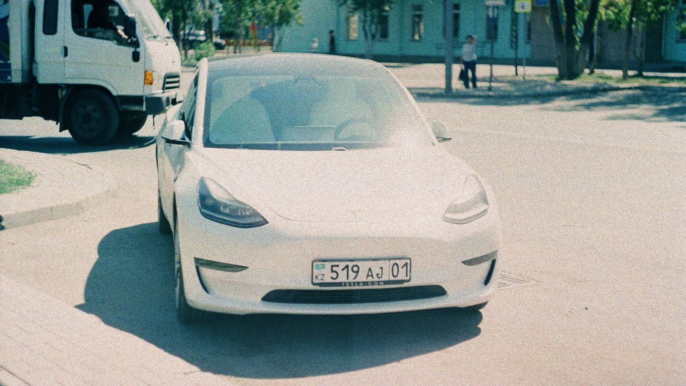 a white car parked on the side of the road