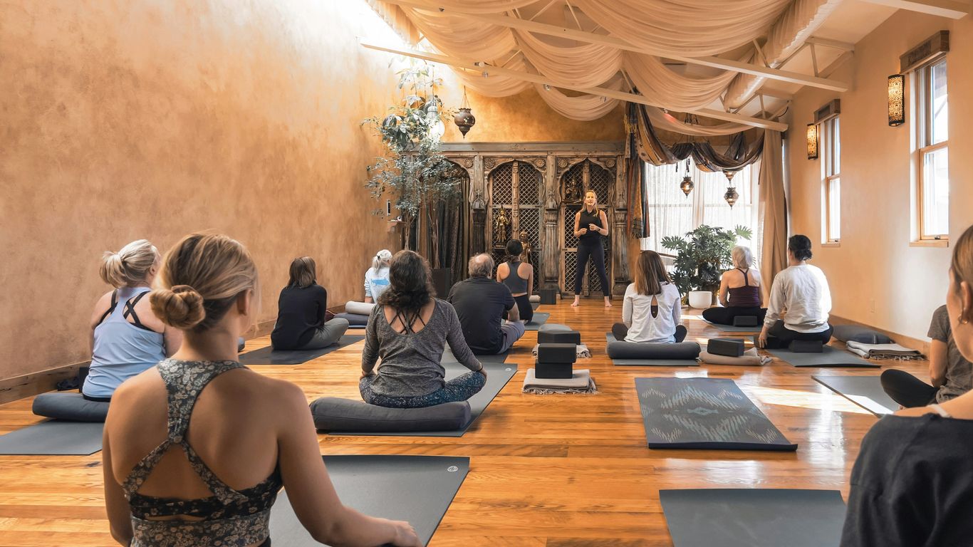 Person practicing yoga in a bright studio