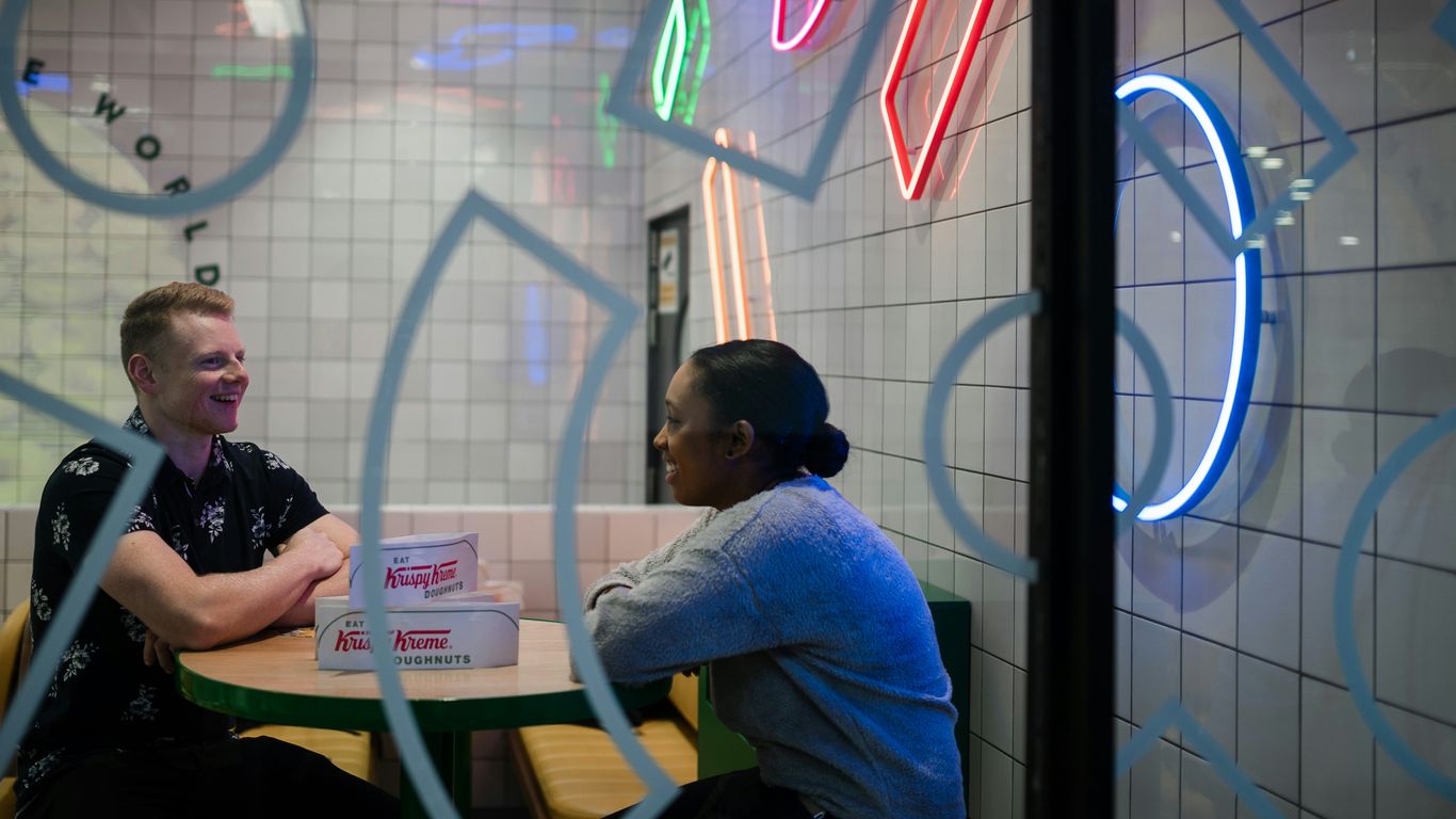 man and woman walking inside store