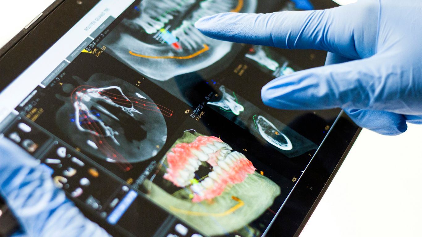 person in blue long sleeve shirt holding black and white tray